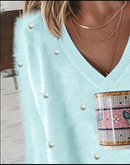 Magdalena | Jersey de punto con cuello de pico y perlas