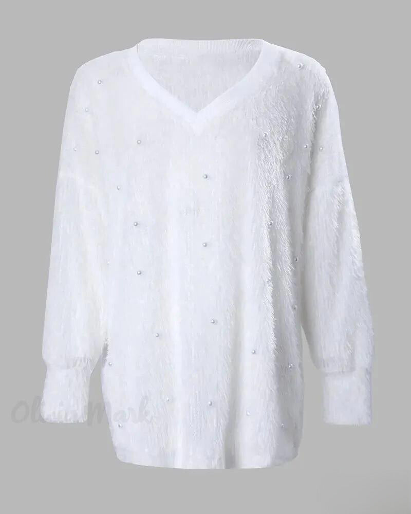 Magdalena | Jersey de punto con cuello de pico y perlas